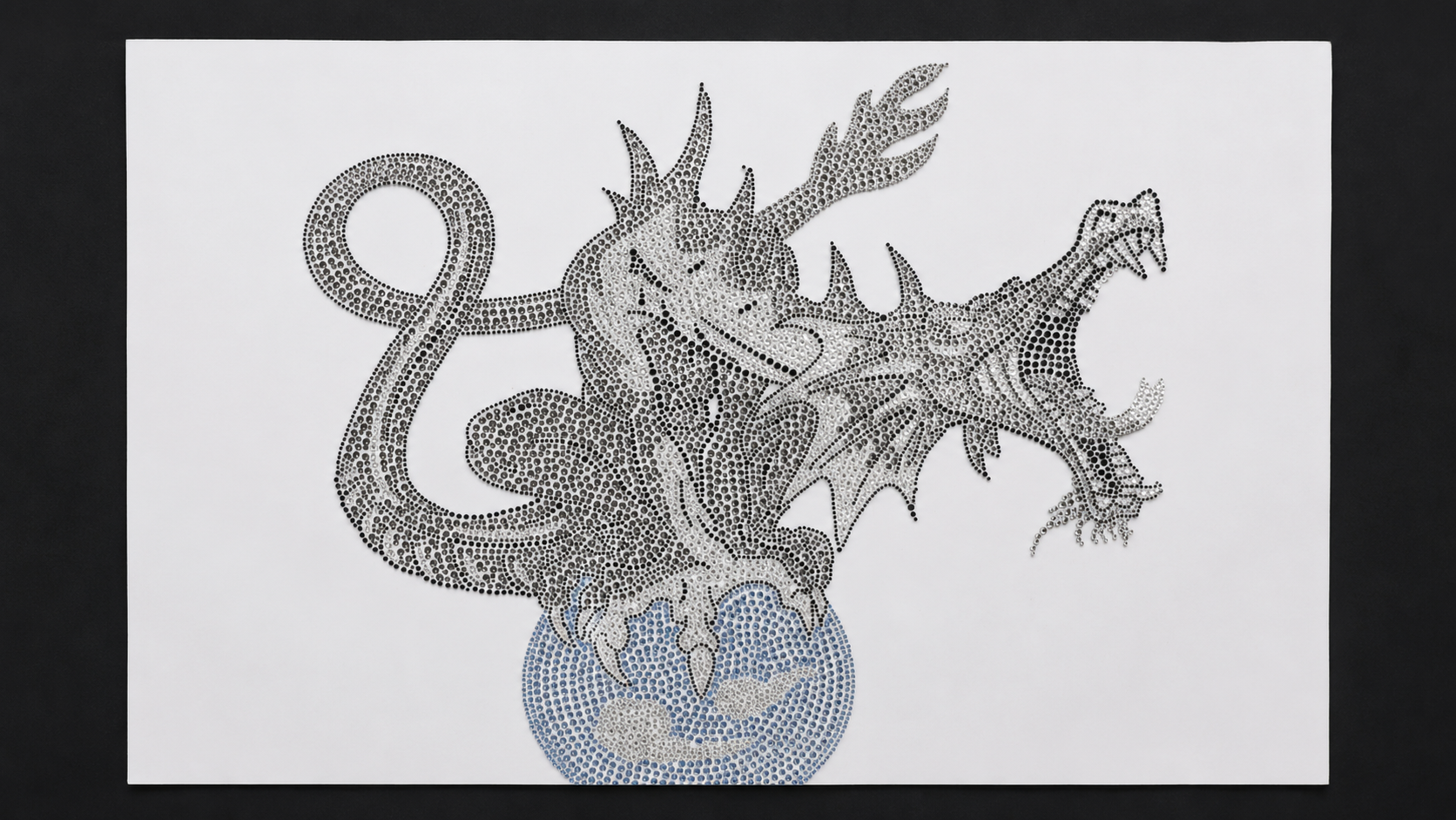 Large-format silver and blue rhinestone dragon motif using multiple stone sizes